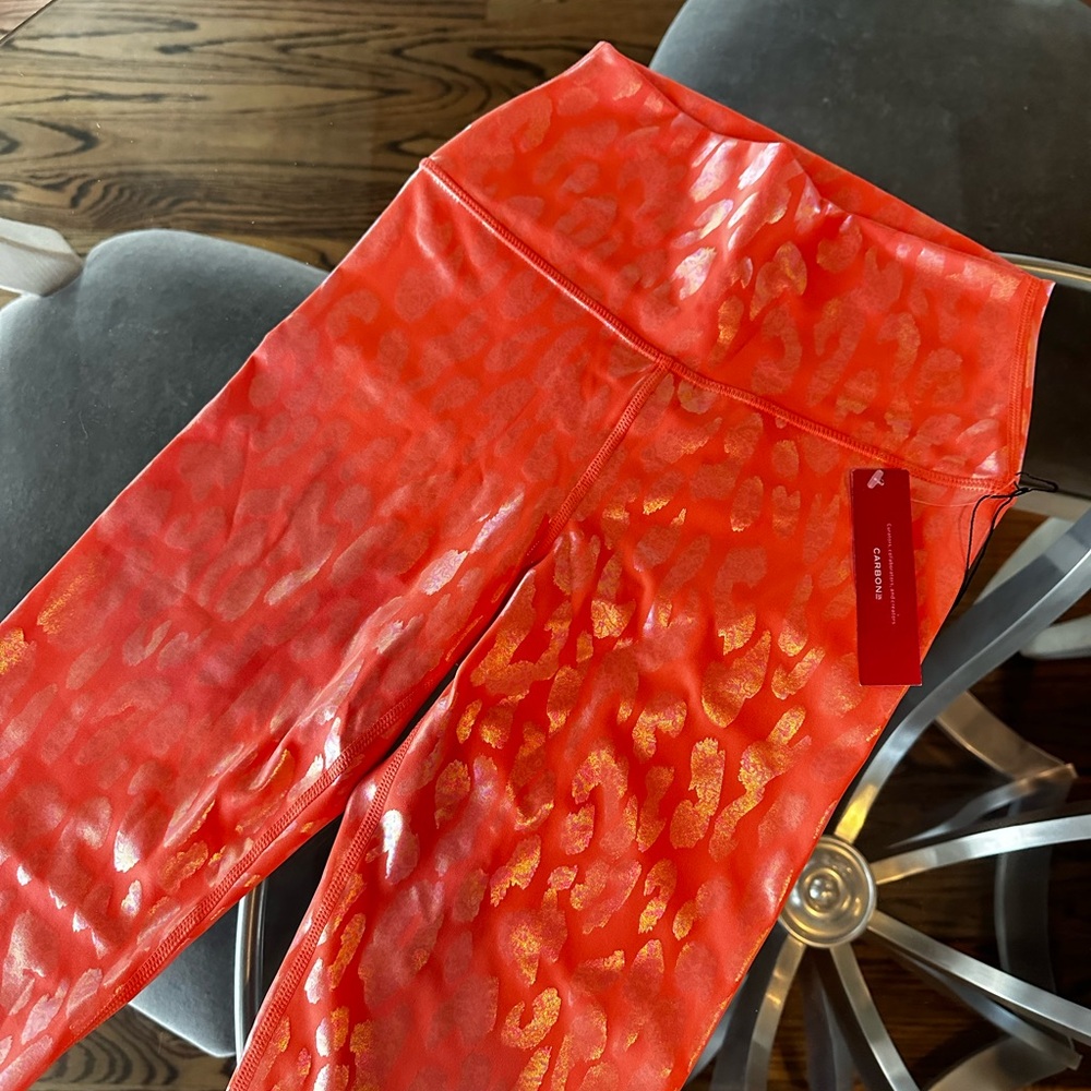 Carbone leggings. Vibrant Orange Leopard BRAND NEW WITH TAGS! Originally $128